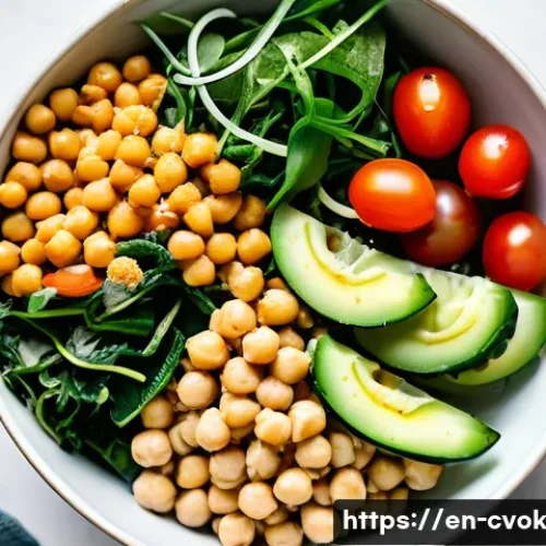 Home 33 대체 단백질 요리법으로 만드는 간편한 점심 레시피 - A vibrant plant-based power bowl featuring cooked chickpeas tossed with fresh cucumber slices, halve...